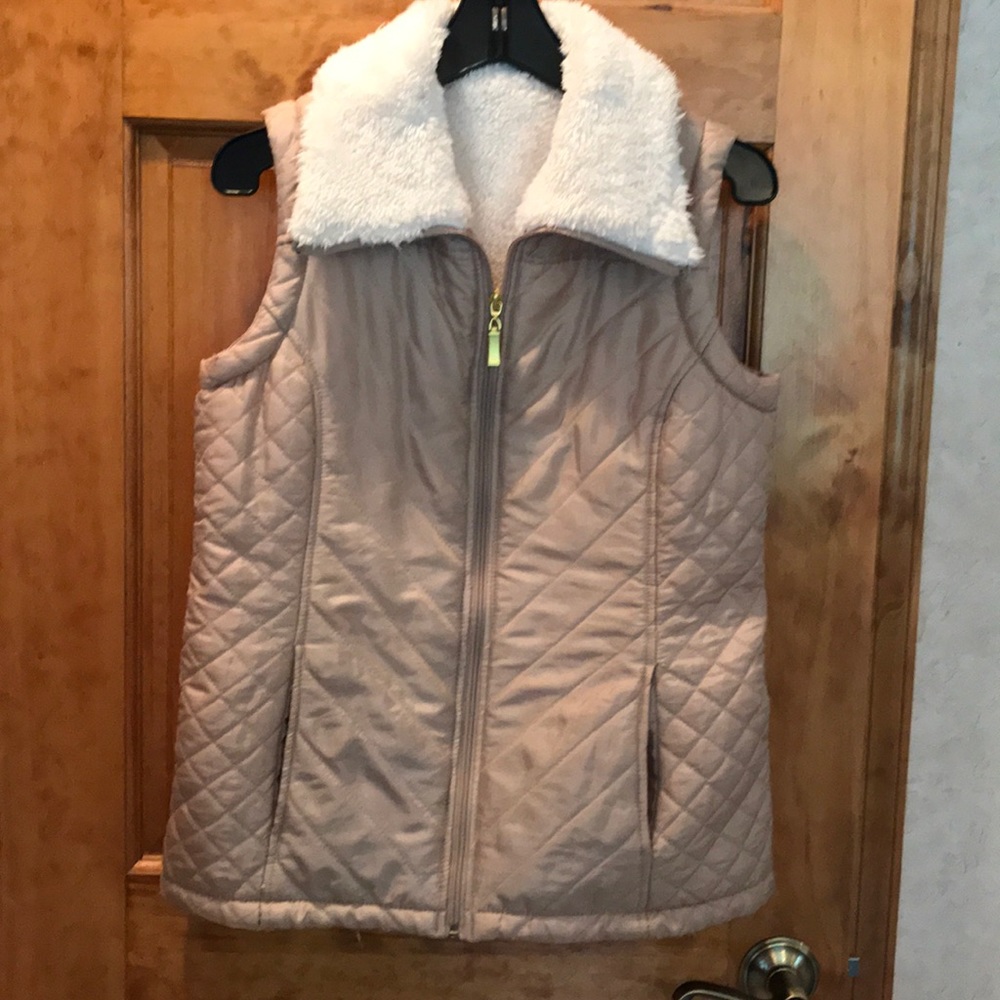 A champagne colored vest